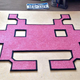Illustration for article titled A Retro Rug That Only Battles Dirty Shoes, Not Invaders From Space